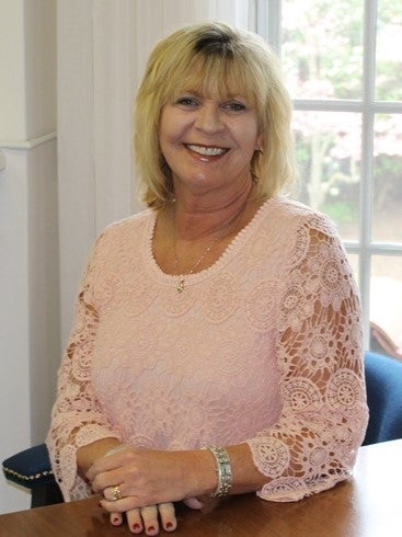 Tamela's profile setting in front of a window