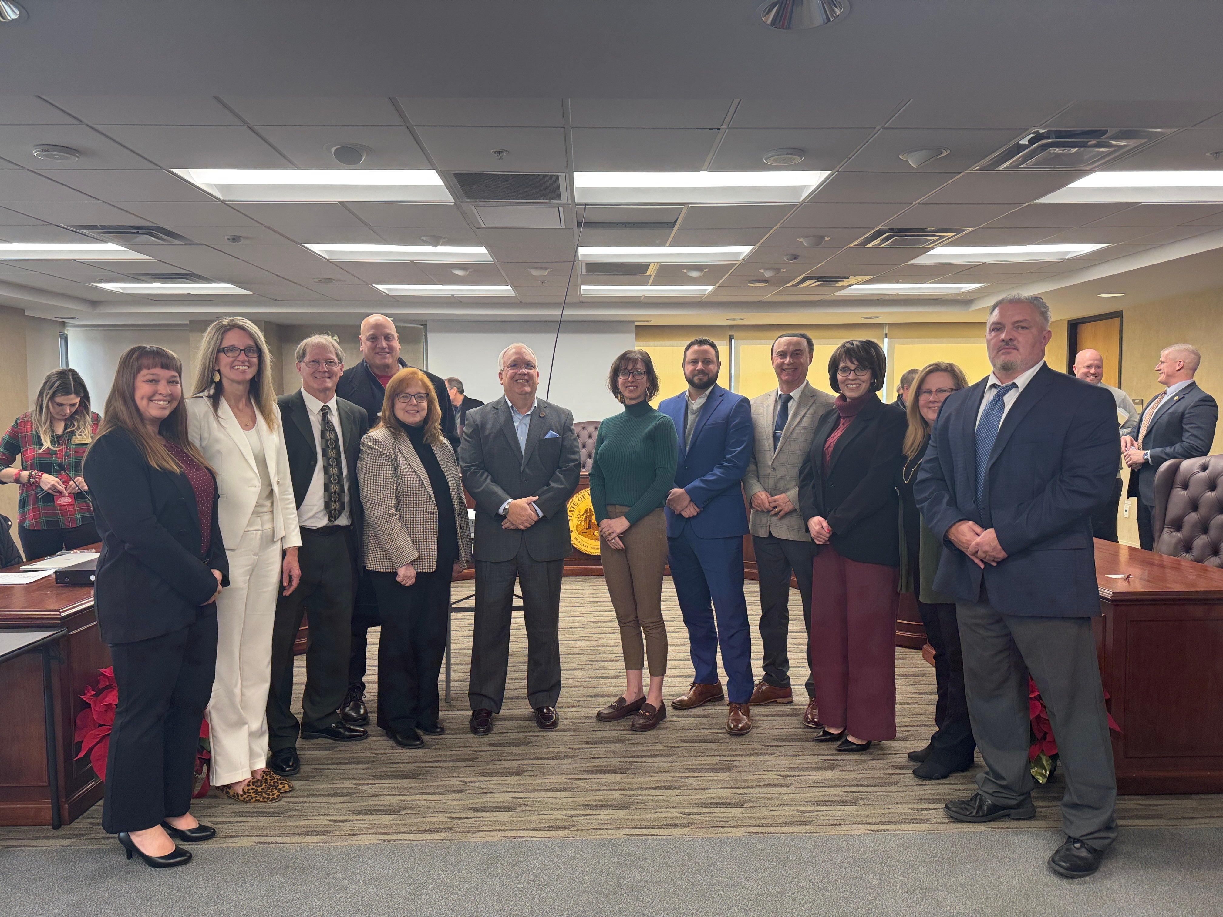 County Superintendents poses with Executive Director Andy Neptune after Needs funding meeting