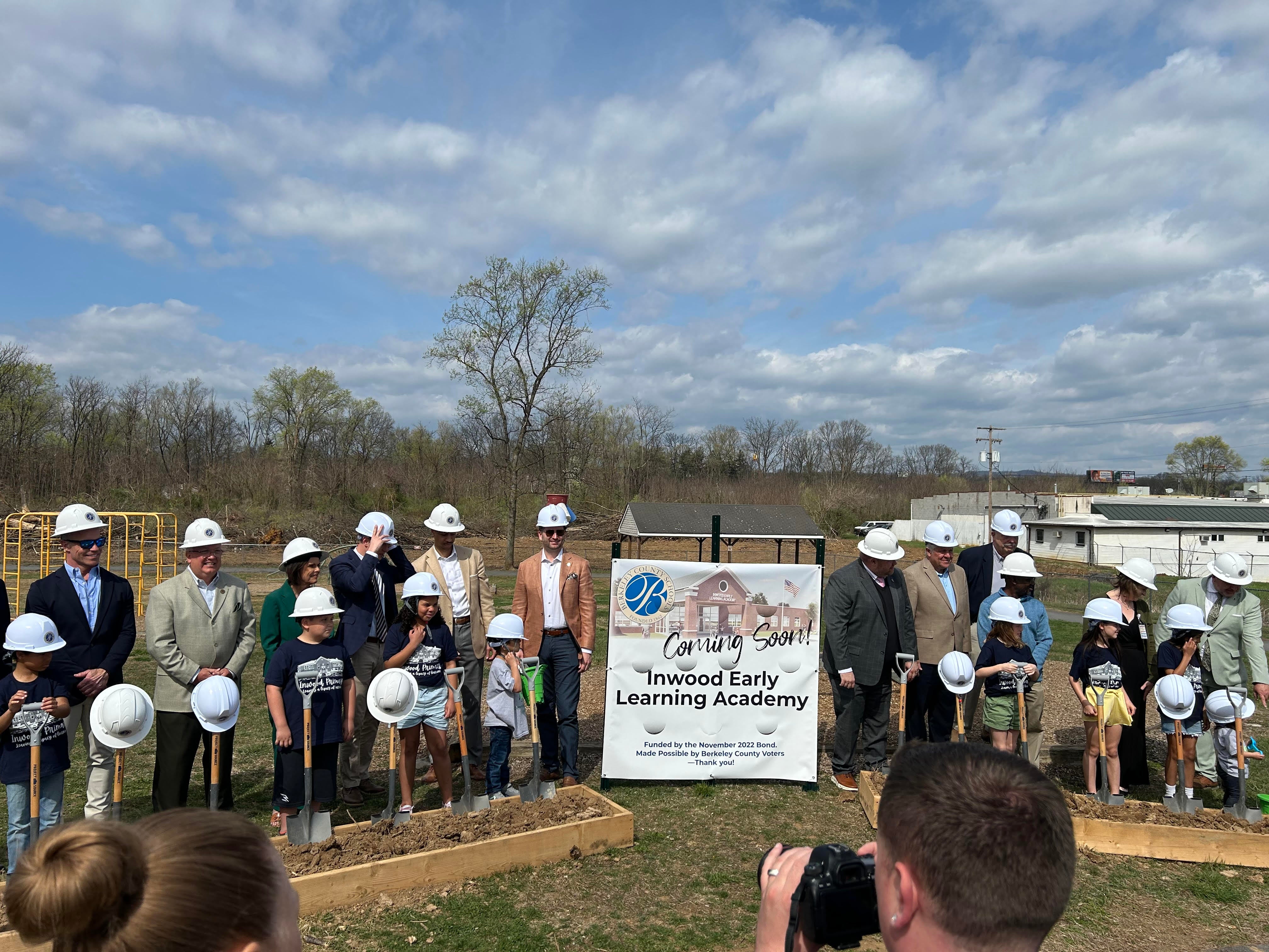 Guest and Student shoveling dirt